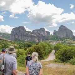 Tourists admire the stunning Meteora price, with its towering rock formations and monasteries.