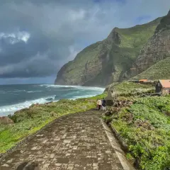 A scenic walk along the coast of Madeira, with dramatic cliffs and crashing waves. This view captures the essence of a week in Madeira.