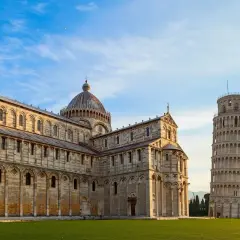 The Leaning Tower of Pisa stands proudly next to the cathedral, a must-see landmark after arriving at Pisa Airport.