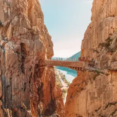 A breathtaking view of the Caminito del Rey, a famous walkway built into the side of a gorge, showcasing incredible walks in Spain.