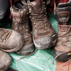 Muddy hiking boots, a testament to adventure. Learn how to care for waterproof leather boots to keep them ready for the next trail.