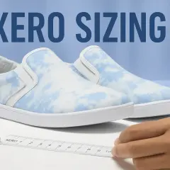 A Xero shoes size guide is shown with a ruler measuring a pair of blue and white tie-dye slip-on sneakers.