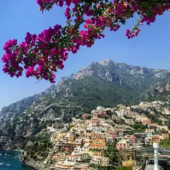 A stunning view of Positano, a colorful cliffside village on the Amalfi Coast, perfect after your trip from Naples airport.