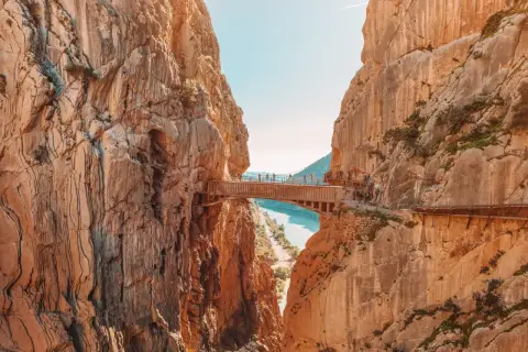A breathtaking view of the Caminito del Rey, a famous walkway built into the side of a gorge, showcasing incredible walks in Spain.