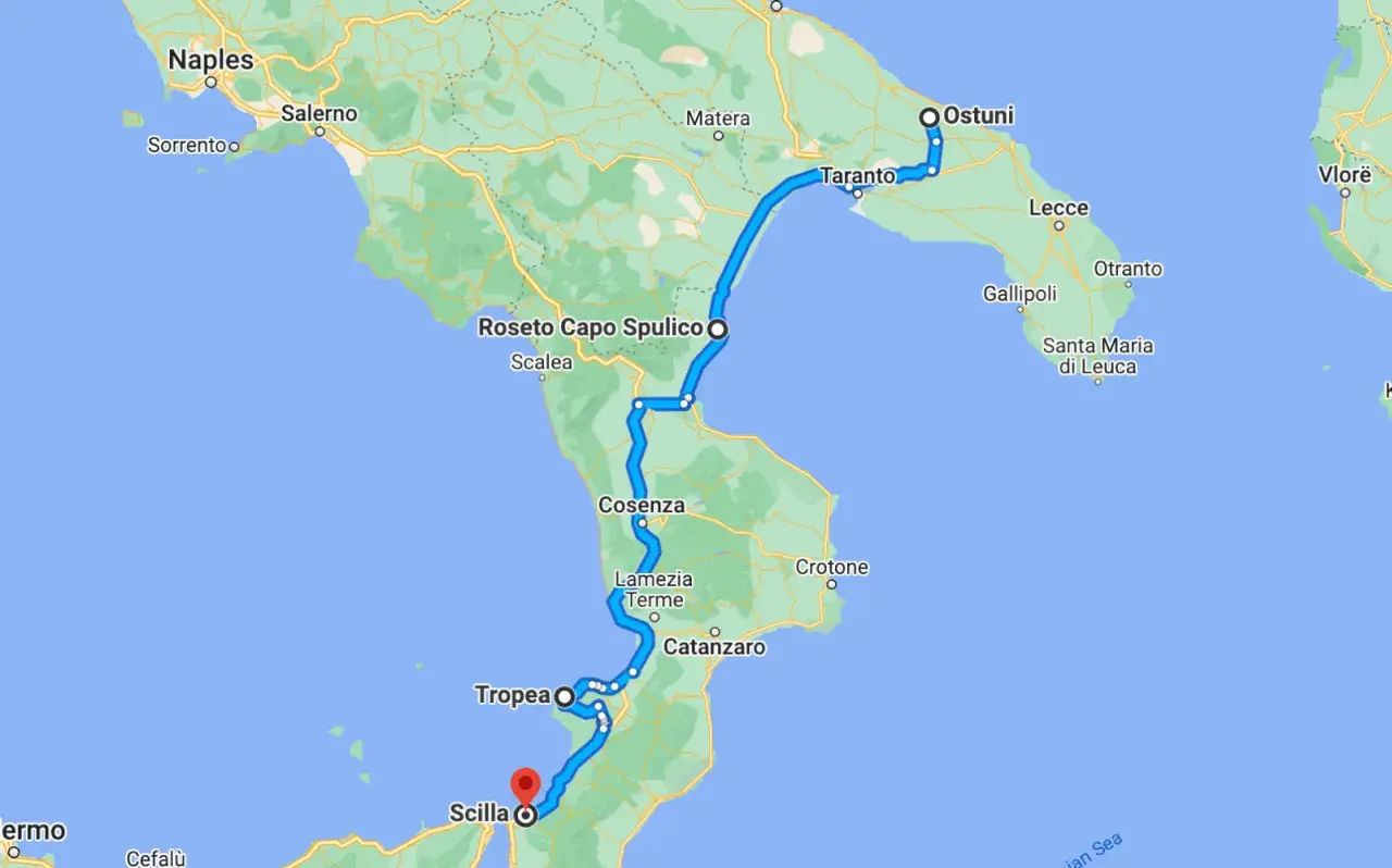 Map showing a road trip route from Naples through Calabria, Italy, passing cities like Cosenza, Tropea, and Scilla.