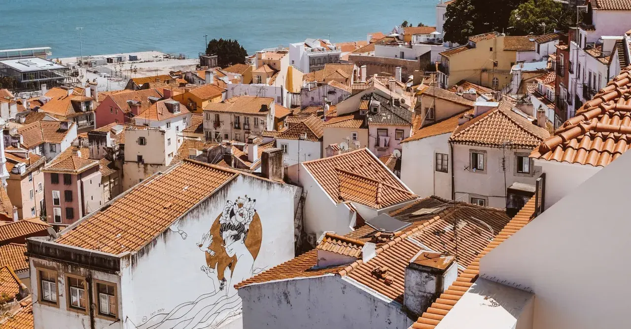 Alfama, Lisbon, is a charming, historic district with narrow streets and colorful buildings. It's generally considered safe for tourists.
