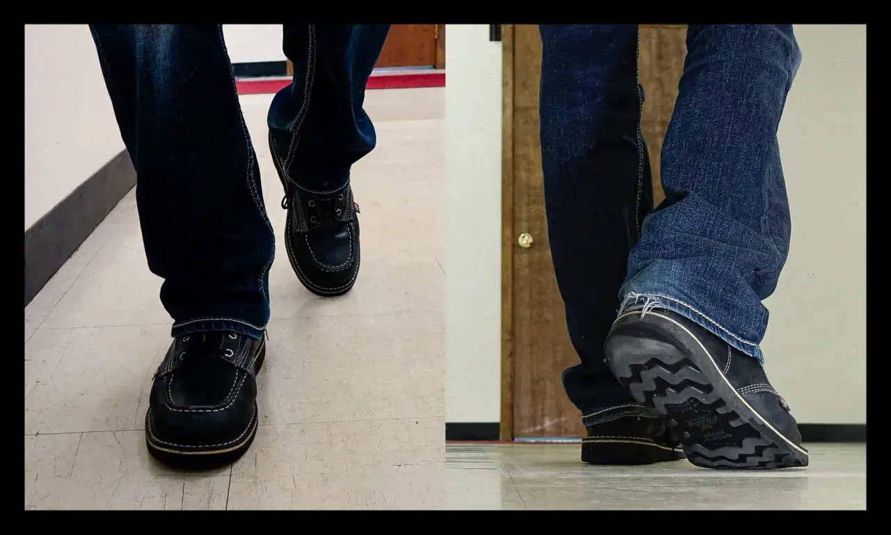 Close-up of feet in jeans and dark shoes. The shoes are made of what looks like real leather, and you can almost hear them squeak with every step.