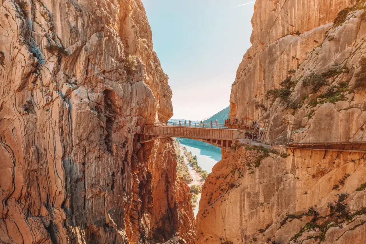 A breathtaking view of the Caminito del Rey, a famous walkway built into the side of a gorge, showcasing incredible walks in Spain.