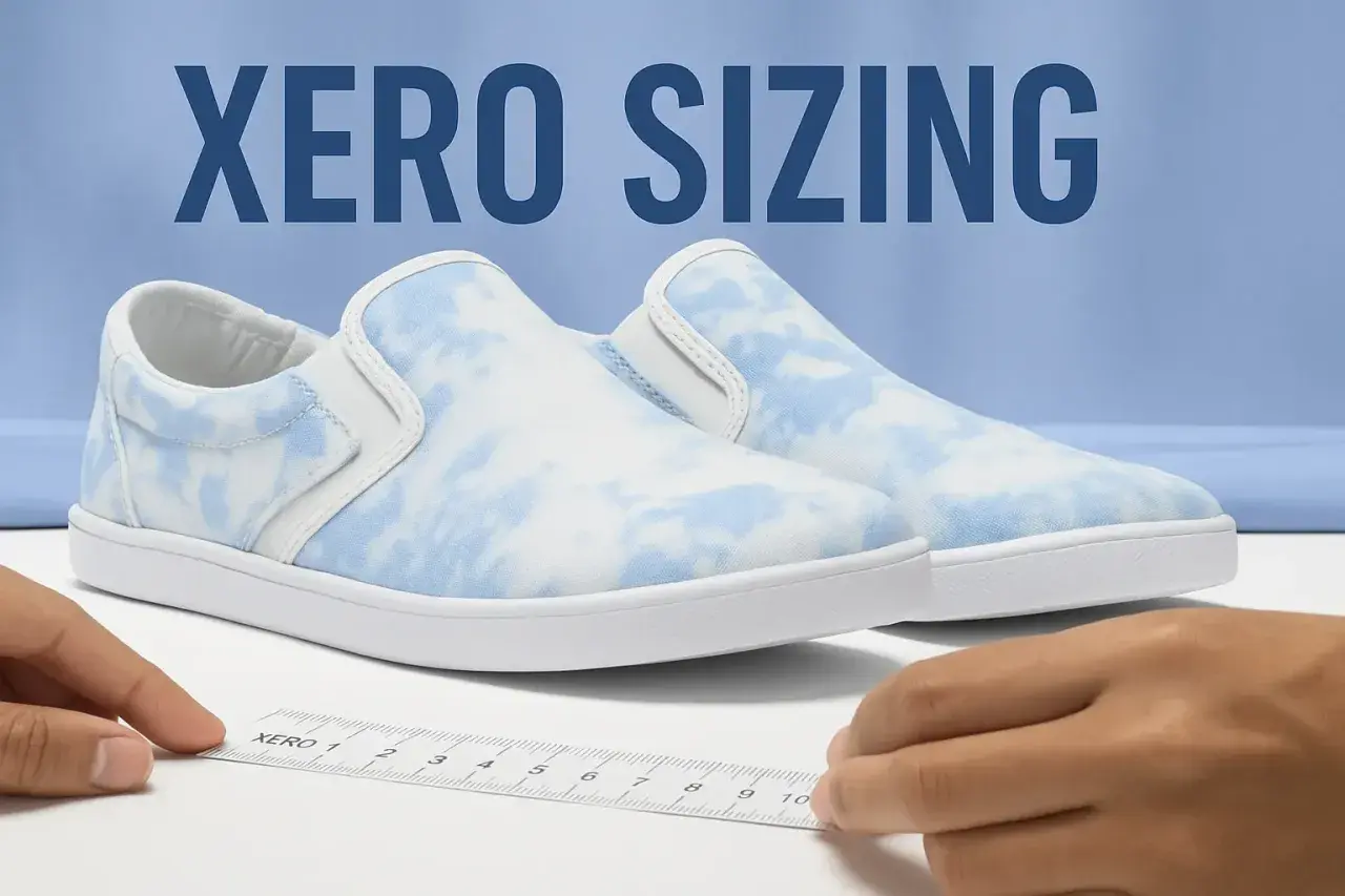 A Xero shoes size guide is shown with a ruler measuring a pair of blue and white tie-dye slip-on sneakers.