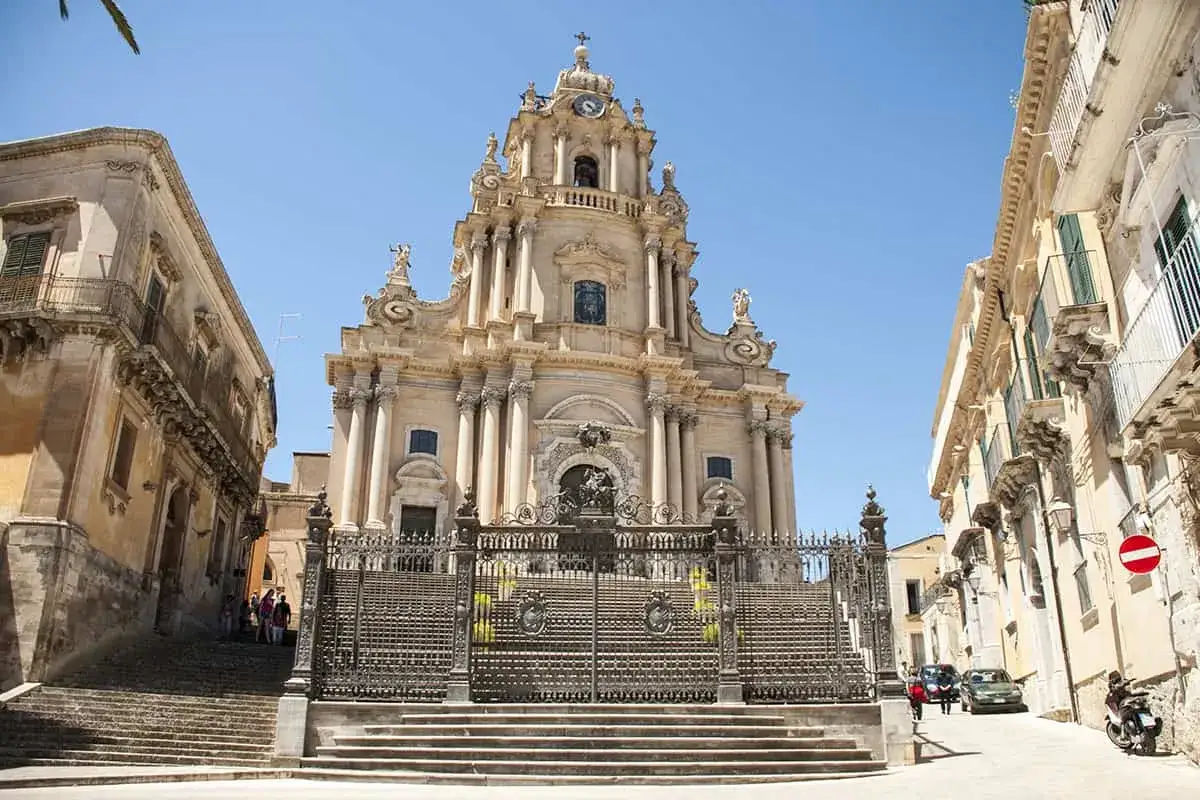 Baroque church facade in Ragusa, Italy, with ornate details and a grand staircase. A must-see for things to do in Ragusa.