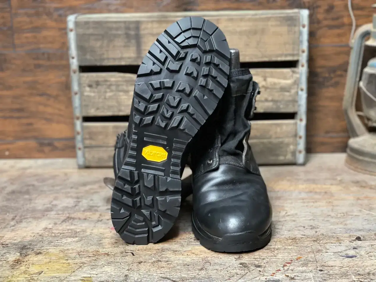 Black boots with aggressive tread Vibram soles, designed to be non-slip for any adventure.
