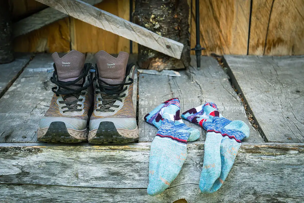 Hiking boots and colorful socks to wear with hiking boots are ready for the trail.