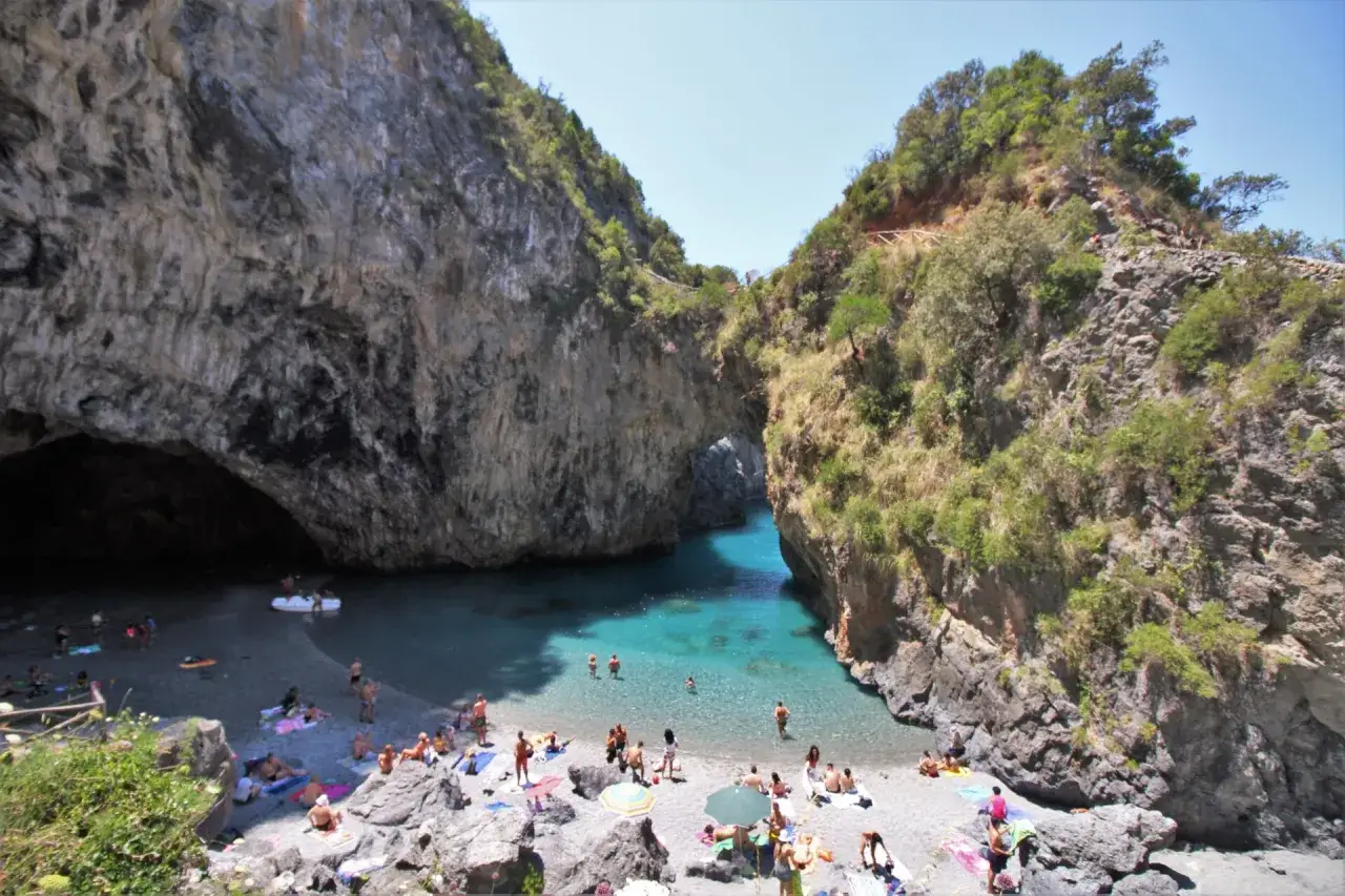 A stunning cove with turquoise water and a pebble beach, perfect for sunbathing and swimming. This is a must-see destination for anyone wondering where to go in Calabria.
